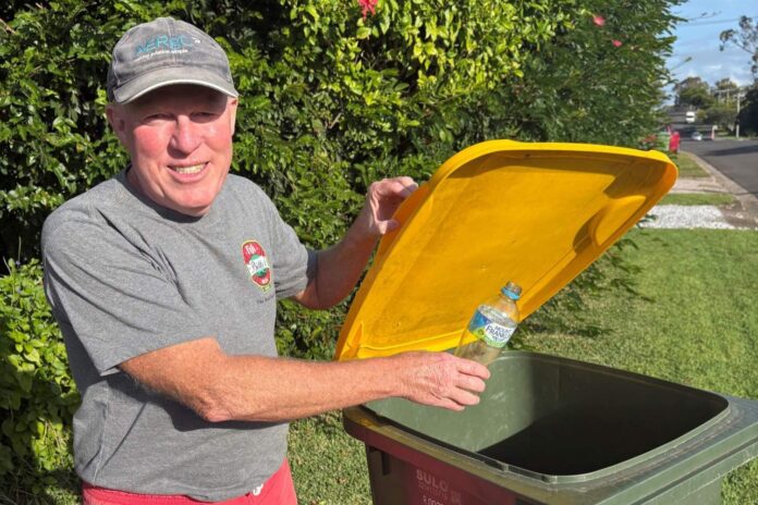 Noosa resident Rob McNamara with a recycling bin.