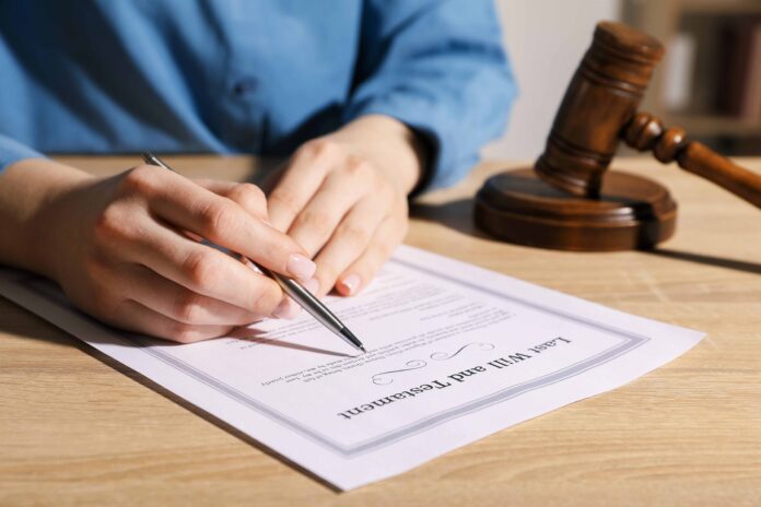 man writing his will. shutterstock