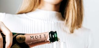 woman pouring Moet champagne. Picture: shutterstock