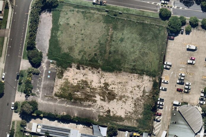 An aerial shot of a vacant site at Pacific Paradise.