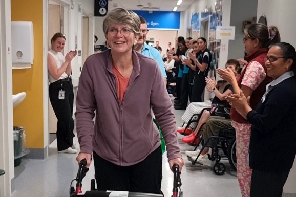 Suzanne Parker makes her way out of the hospital.