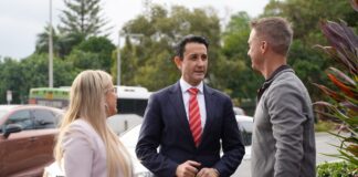 Premier David Crisafulli, centre, with Caloundra MP Kendall Hatcher and Dicky Beach IGA’s Shane Kensett.