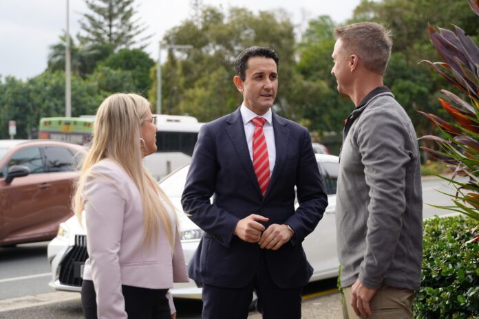 Premier David Crisafulli, centre, with Caloundra MP Kendall Hatcher and Dicky Beach IGA’s Shane Kensett.