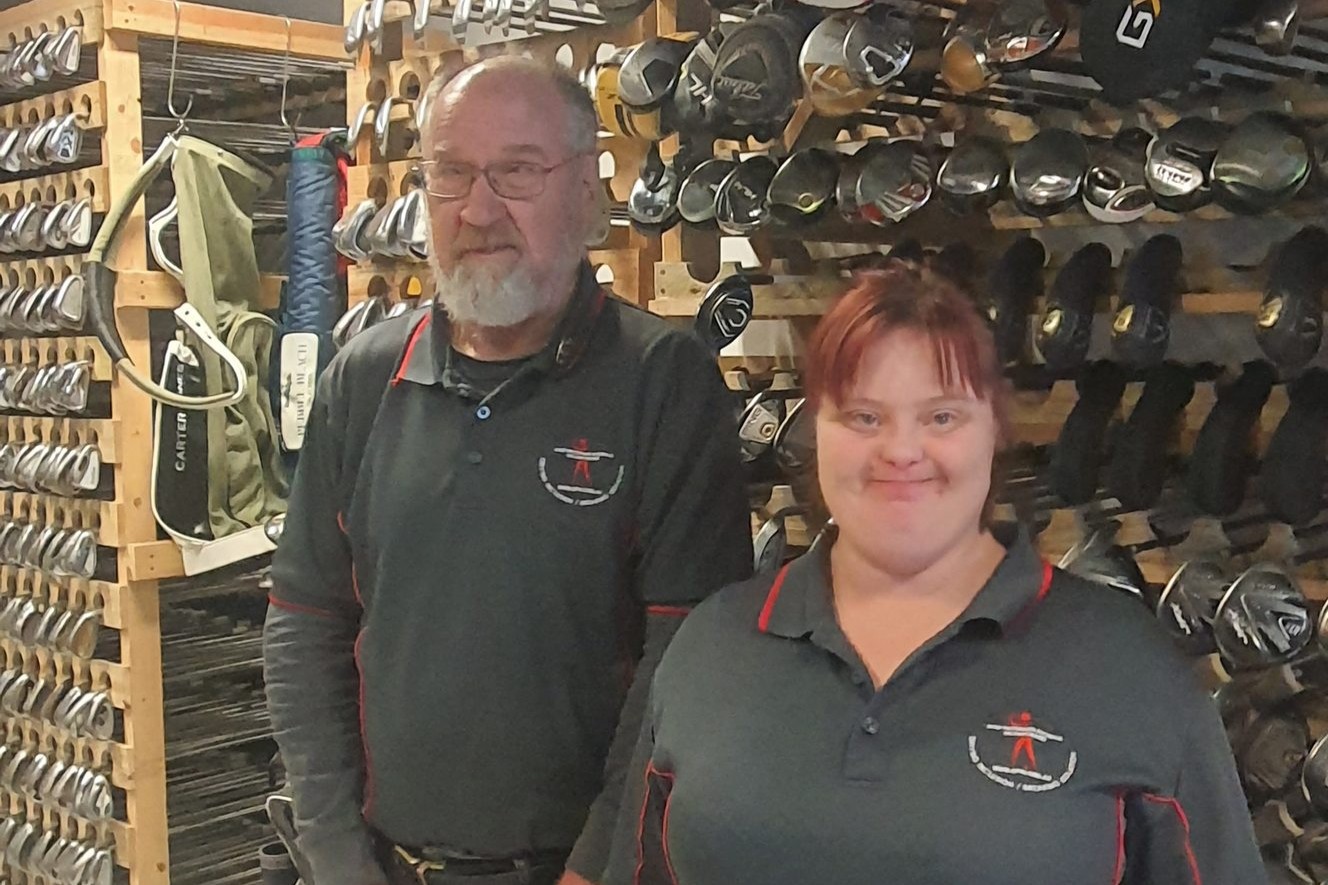 Golfers Bevan Ashworth and Sophie Bolton at the new shop.