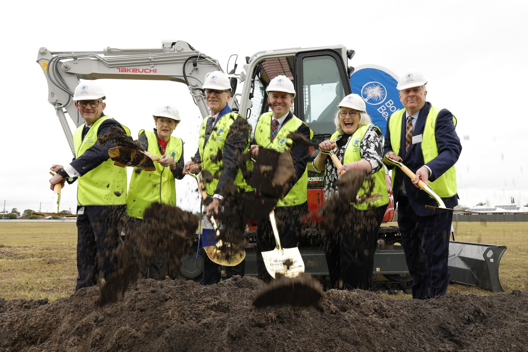 Project partners signal the start of works by digging up soil, for the Bokarina Beach Village.
