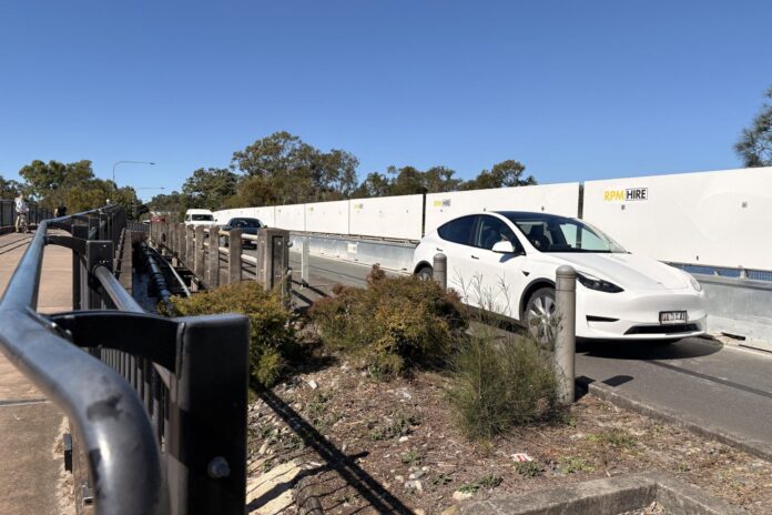 Vehicles cross the open lane on the Doonella Bridge on Monday.