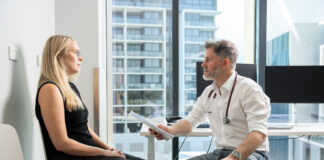 A doctor and a patient in a room.