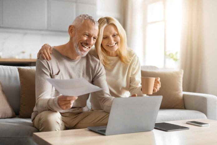 Shutterstock picture of elderly couple in front of laptop