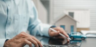 Man with calculator, picture from shutterstock