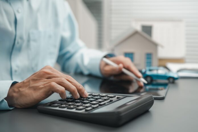 Man with calculator, picture from shutterstock