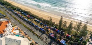 Runners on the Sunshine Coast Marathon course, by the beach, pictured from 2024.