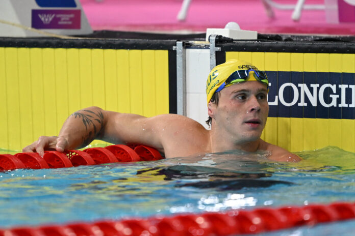 Isaac Cooper in the pool at the end of a race at Glasgow 2026.