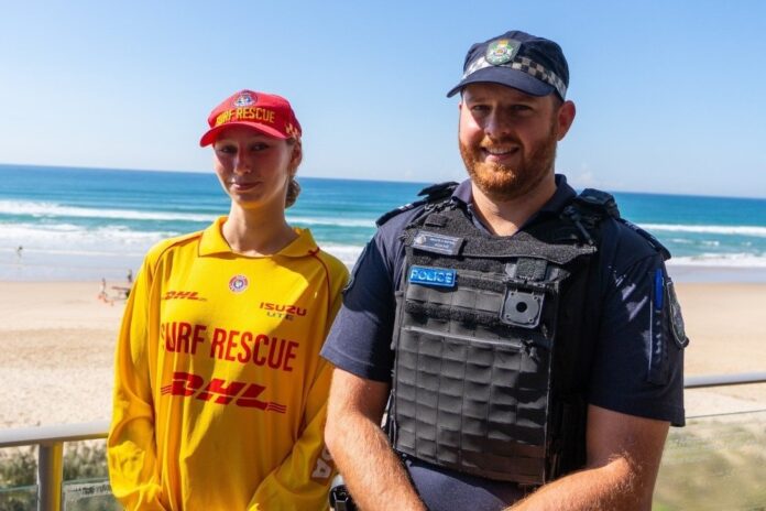 SLSQ volunteer Skye Wildman and QPS Senior Constable Peter Elford at the beach.