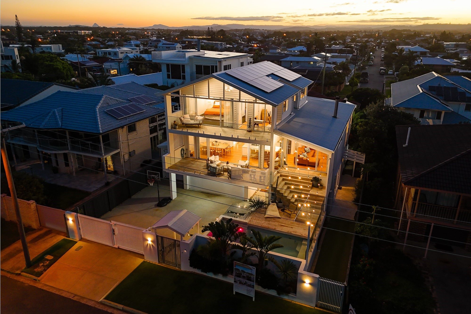 Night shot showing the luxury home's location on Pacific Boulevard, Buddina.