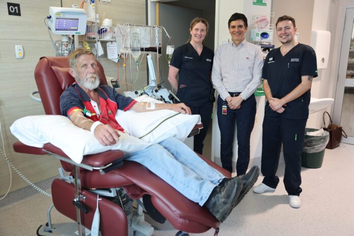 Clinical nurse consultant Kylie Stevens, Professor Craig Wallington-Gates and clinical nurse Alex Thorpe with a patient.
