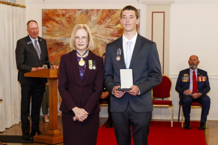 Governor of Queensland and Patron of the Royal Humane Society of Australasia Jeanette Young with bravery award recipient Zayde Taylor.