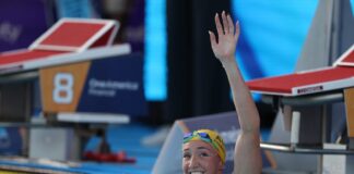 Lani Pallister waves to the crowd from the pool at the Pan-Pacs.