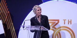 Sunshine Coast Business Association chair Jenny Swaine on stage.