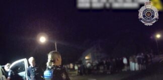 Officers monitor a group of youths at Buddina.
