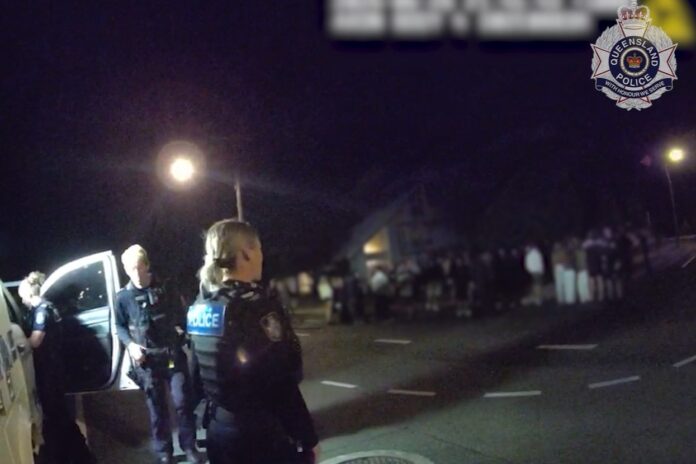 Officers monitor a group of youths at Buddina.