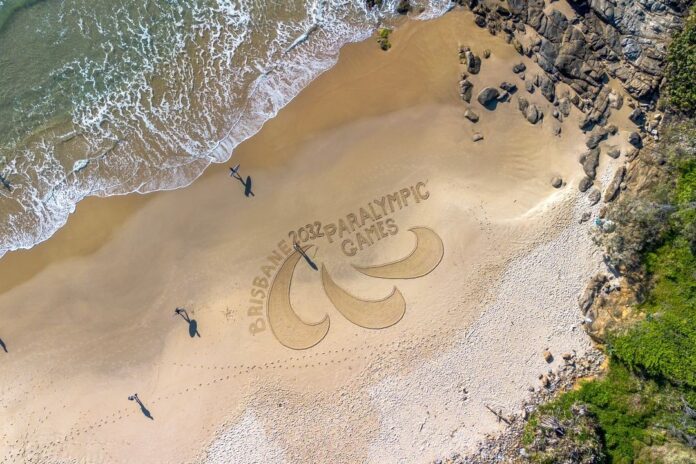 Paralympic logo in sand at Coolum Beach