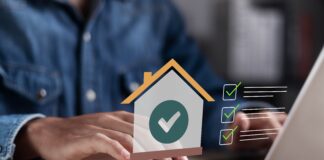 man calculating a home loan shutterstock