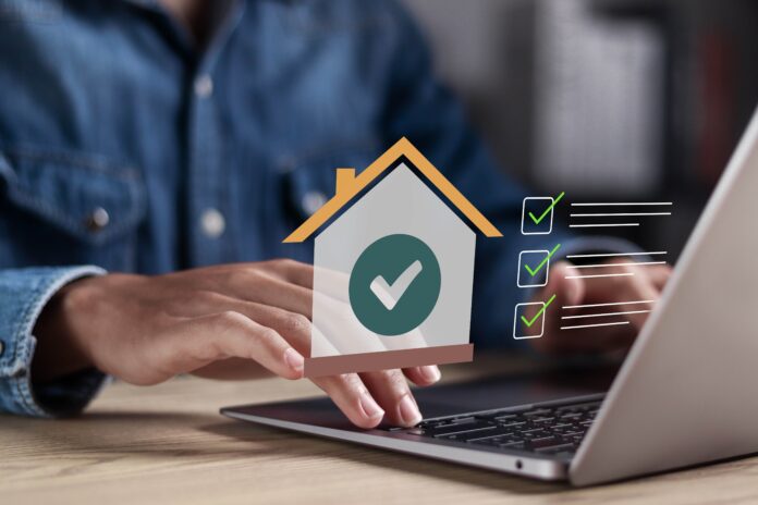 man calculating a home loan shutterstock