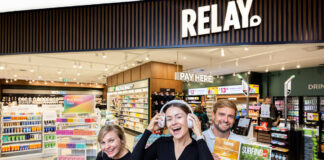 Three people in front of the Relay store.