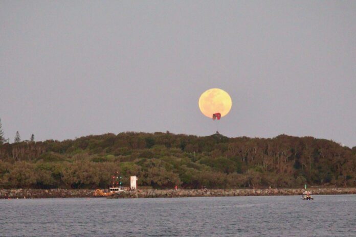 full moon rising over Pt Cartwright Greg Brydon on Aug 28, 2026
