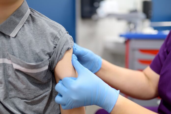 A boy is being vaccinated