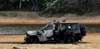 A burnt out car on the beach