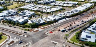 An aerial view of a duplicated intersection road in Aura.