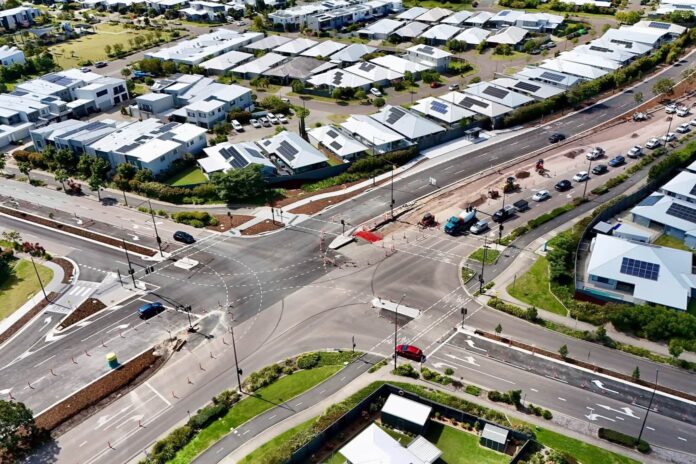 An aerial view of a duplicated intersection road in Aura.