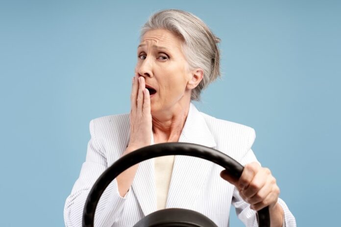 elderly woman drive in shock shutterstock