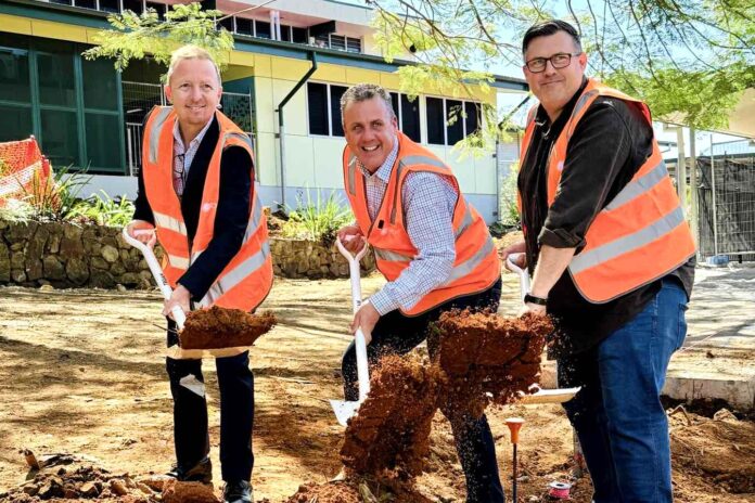 Woombye State School Principal Matthew Meharg, Member for Nicklin Marty Hunt and President of Woombye SS P&C Association Tim James break ground on the project.