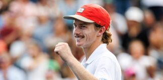 Dane Sweeny smiles with a thumb up on court at the US Open.