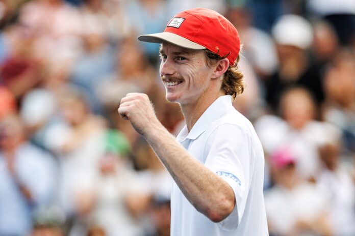 Dane Sweeny smiles with a thumb up on court at the US Open.