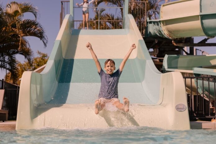 A kid on a water slide at Ingenia Holidays Rivershore.