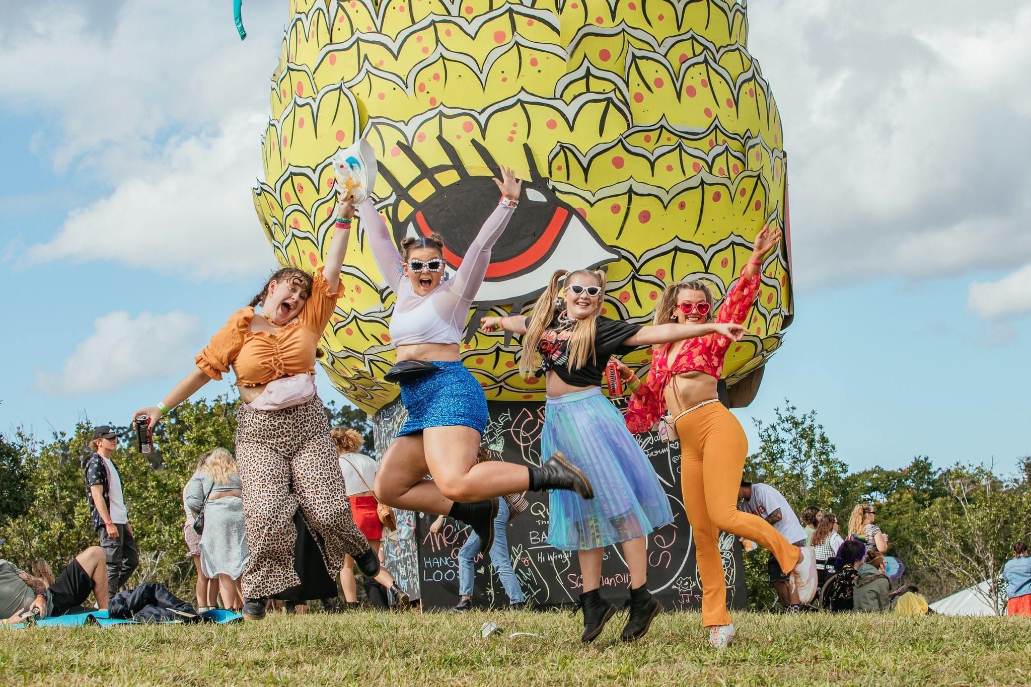 Revellers jumping for joy ahead of the 2024 Big Pineapple Festival.