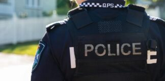 The back of a police officer.