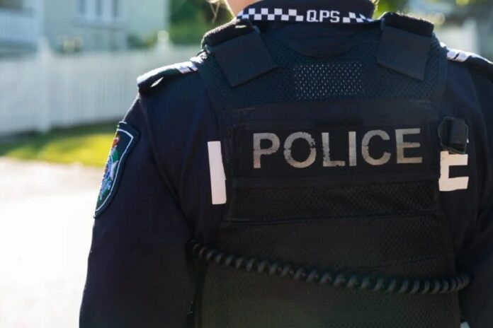 The back of a police officer.
