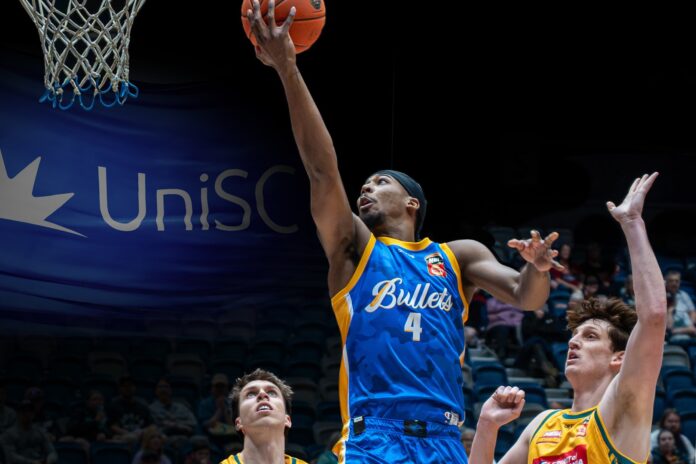 A Brisbane Bullets player makes a lay-up.