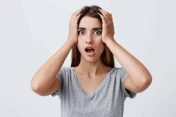 a forgetful looking woman from Shutterstock