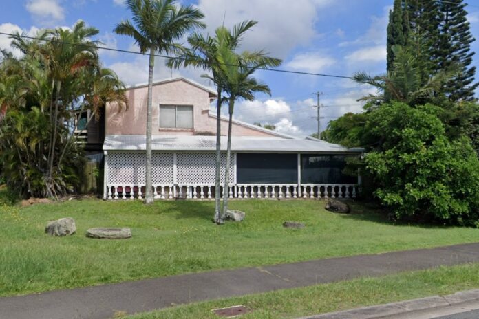 Old, rundown pink house.
