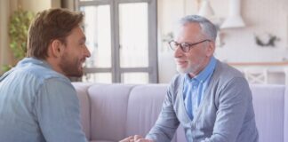 young man talking to his father from Shutterstock