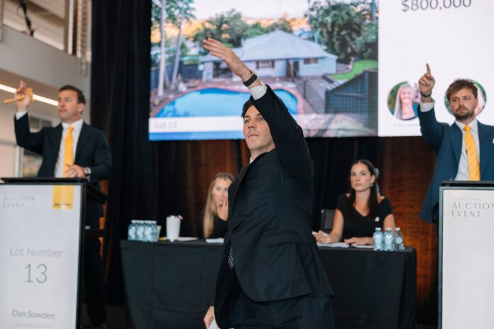 Auctioneers at a Ray White event.