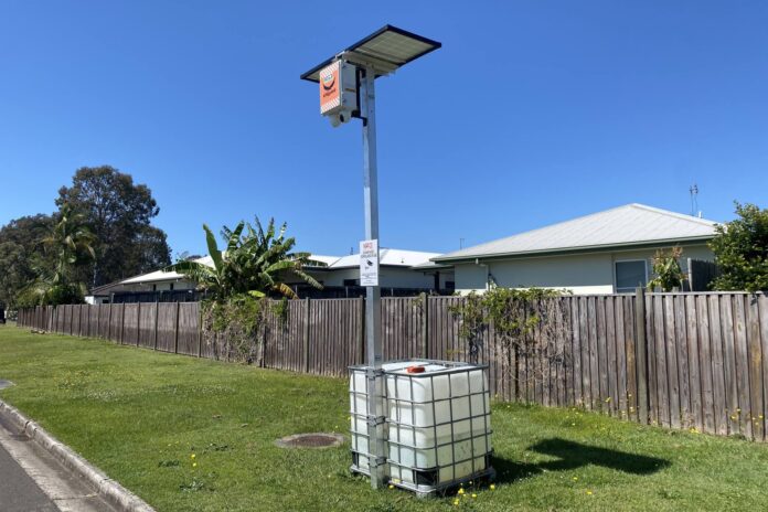 A 24-hour camera beside a street.