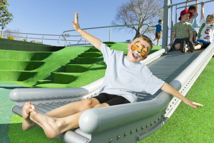 Oakley Mills on a slide at Boab Oasis Park. Picture: Renae Droop/RDW Photography