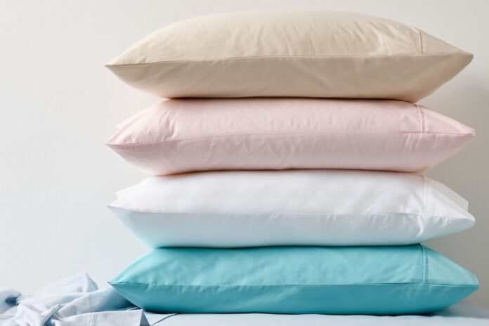 A stack of light coloured pillow cases