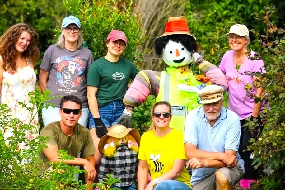 Volunteer gardeners smile for the camera at the Little Mountain Community Garden.